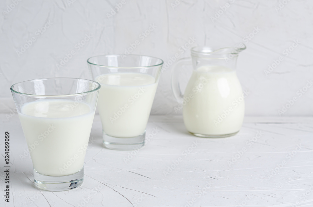 Homemade fermented drink - kefir or bulgaros on a white background with copy space Homemade fermented drink - kefir or bulgaros on a white background with copy space