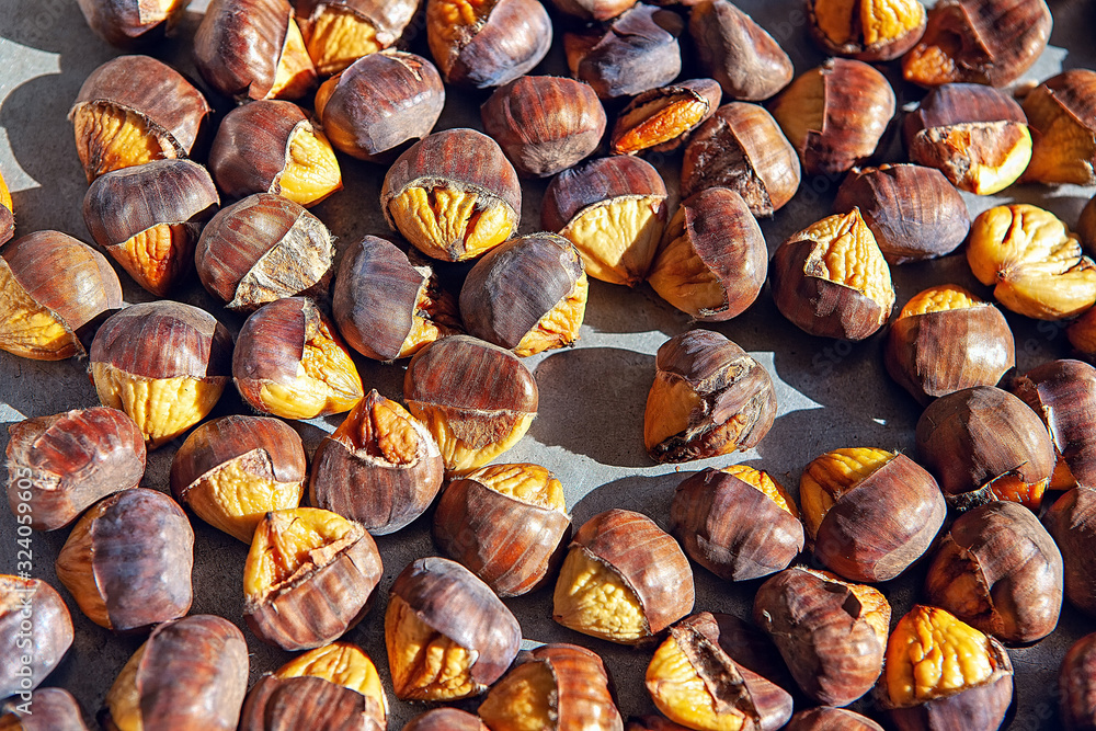background with tasty roasted chestnuts background with tasty roasted chestnuts
