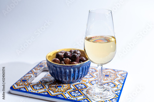 Fortified wine from Andalusia, Spain, different types of sherry in glasses and olives on white background photo