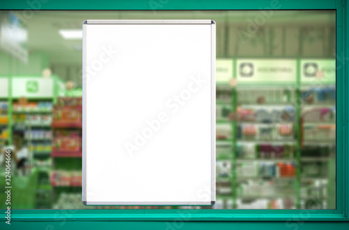 Empty advertising board in drugstore showcase. photo