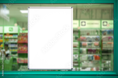 Empty advertising board in drugstore showcase.