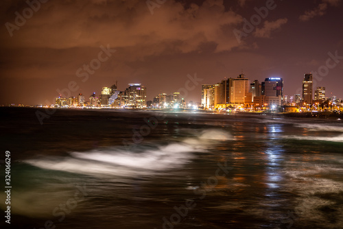 Tel aviv at night with green wave