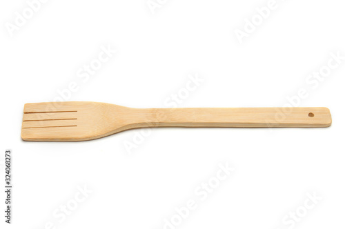 Wooden fork from kitchen utensils on a white background