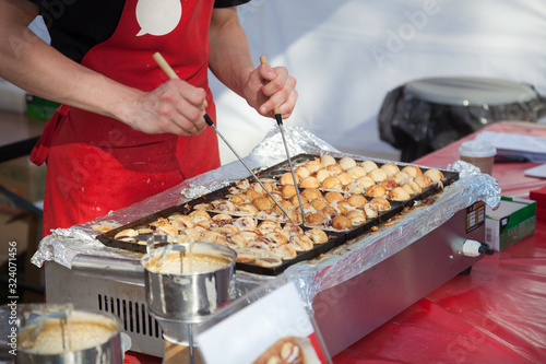 Cooking takoyaki on open air
