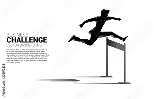 Silhouette businessman jumping across hurdles obstacle. Background concept for Obstacle and challenge in business photo