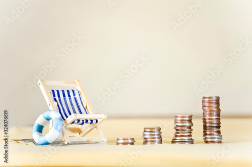 Miniature Beach Chair with Increasing Stacks of Coins