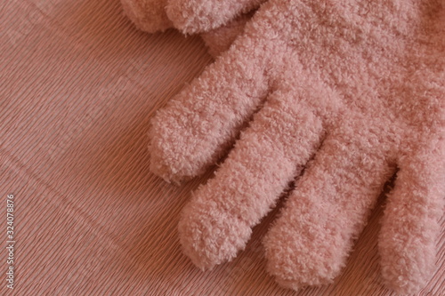 winter gloves on a pink background