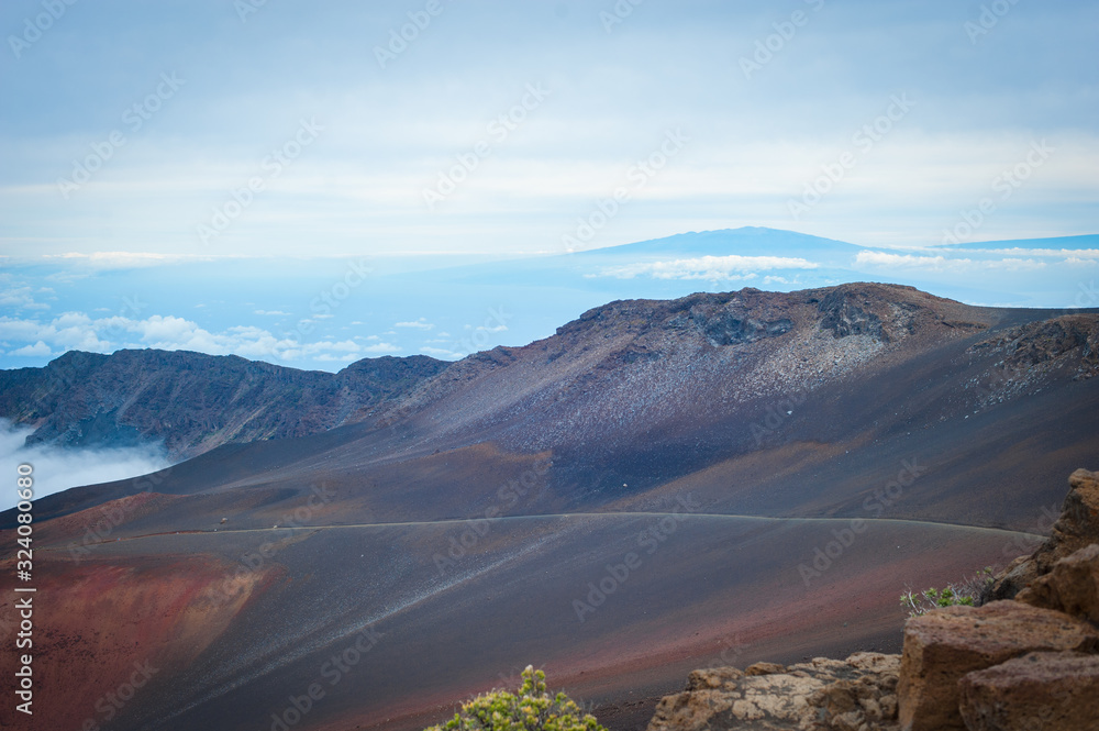 Fototapeta premium Volcano crater area, Haleakala, Maui, Hawaii - The island of Hawaii, Big Island in distance