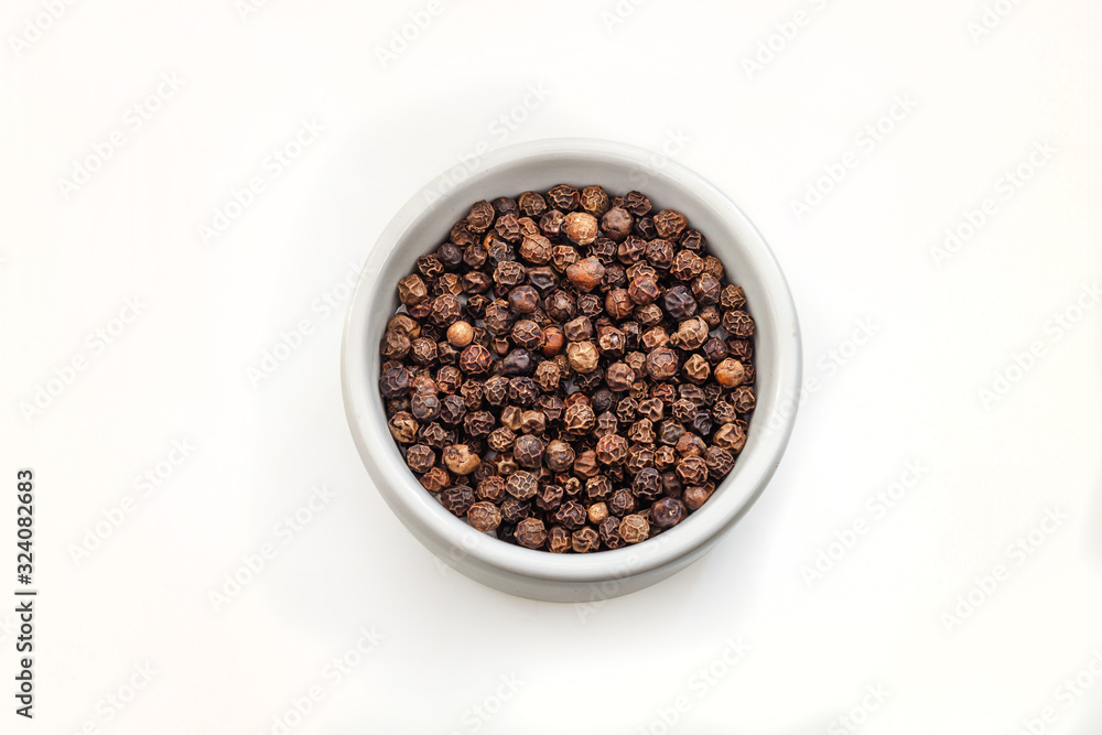 Small pile of black pepper isolated on white background. Small pile of black pepper isolated on white background.