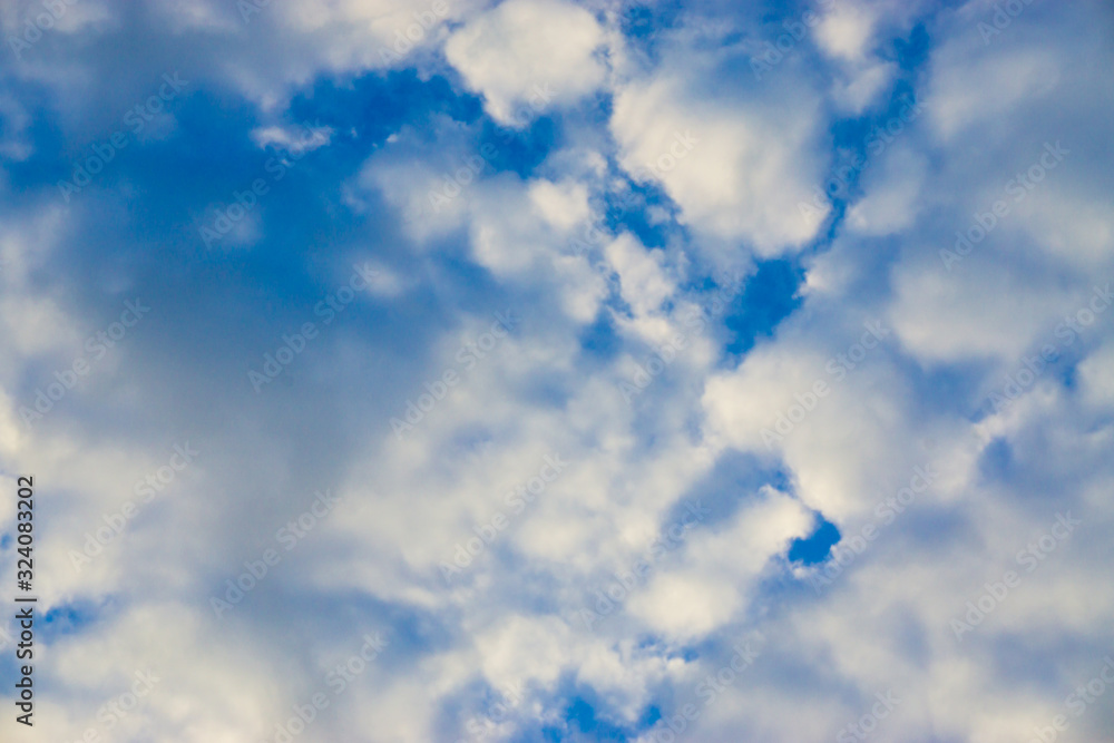 Mostly white cloud against blue sky nature background evening scene Mostly white cloud against blue sky nature background evening scene