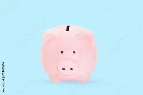 Piggy bank on blue background. Finance concept