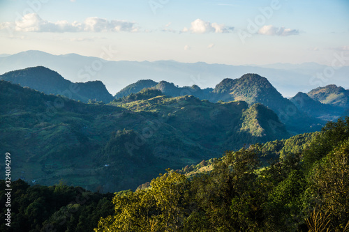 Mountain sunset light with green tropical forest nature landscape