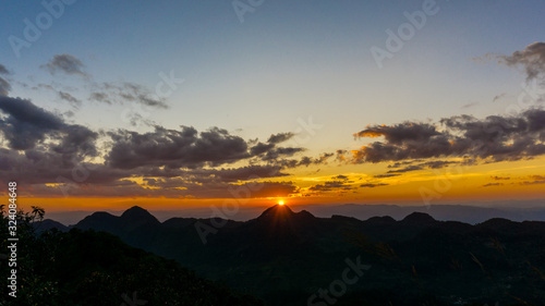 Mountain sunset light with green tropical forest nature landscape