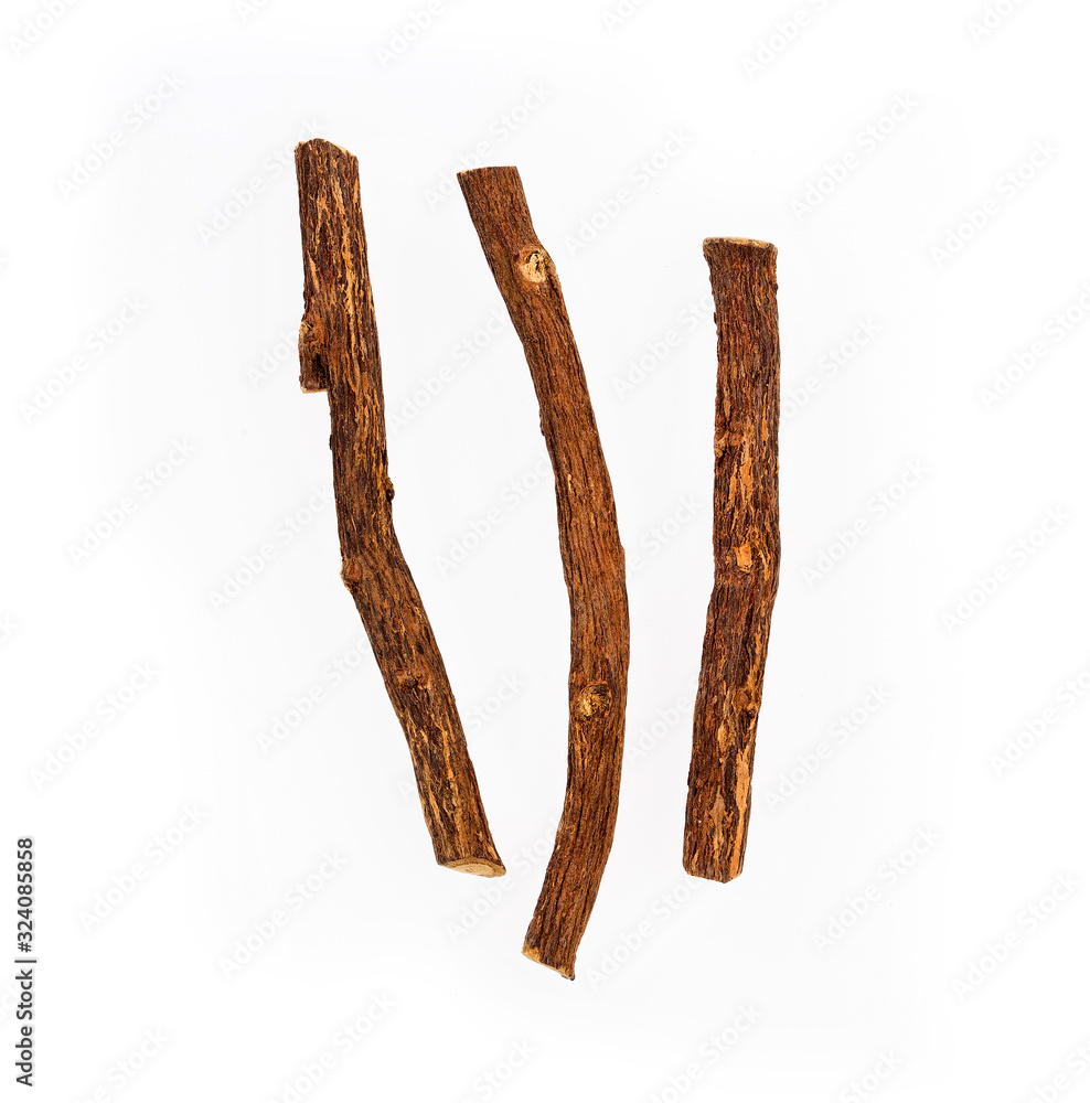 Close up of Ayurvedic herb Liquorice root,Licorice root, Mulethi or Glycyrrhiza glabra root on a wooden surface is very much beneficial for Soothes your stomach,poisoning Close up of Ayurvedic herb Liquorice root,Licorice root, Mulethi or Glycyrrhiza glabra root on a wooden surface is very much beneficial for Soothes your stomach,poisoning