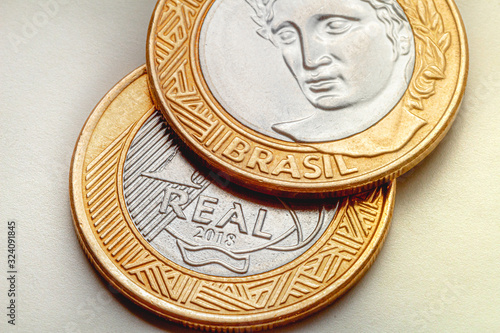 Coin, Real, Reais, Brazilian Currency. Group of one real coins. Clouse-up. photo