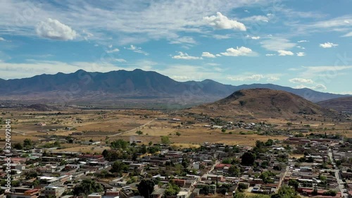 Teotitlan del Valle beautiful traditional mexican village in Tlacolula, Oaxaca, Mexico. Artisan village is famous for hand made carpets. Aerial drone video from the top.  photo