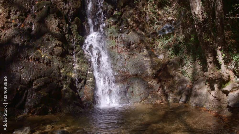 water rushing over rock face in cinematic slow motion waterfall shot water rushing over rock face in cinematic slow motion waterfall shot
