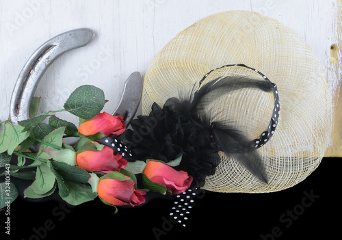 Slika na platnu Kentucky Derby photo of a fascinator hot with red roses and a horseshoe