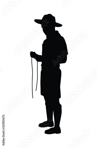 Boy scout with his equipment silhouette vector