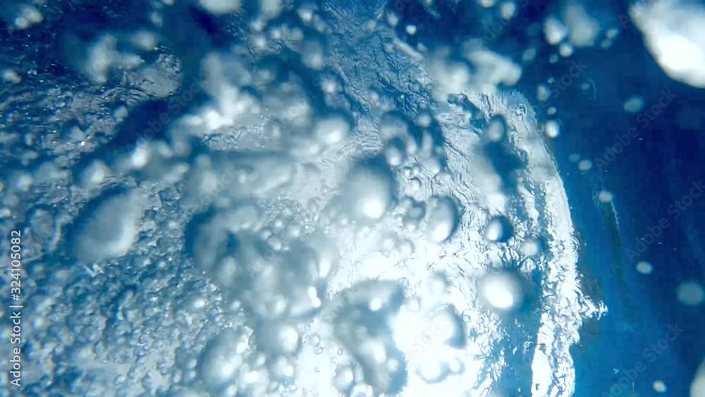Slow motion video of air bubbles floating in swimming pool Slow motion video of air bubbles floating in swimming pool