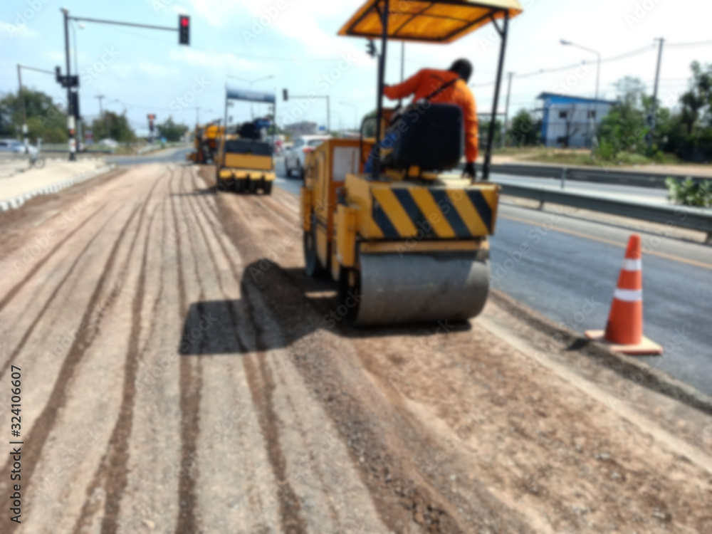 Blurred images of compactors to repair road surface