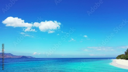 Wallpaper Mural Beautiful bright blue sky with white cloud hanging over calm blue azure sea and white sandy beach of tropical islands in Bali Torontodigital.ca