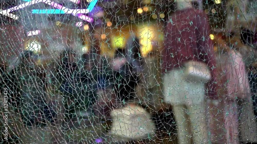 Boutique inside view from outside through broken glass