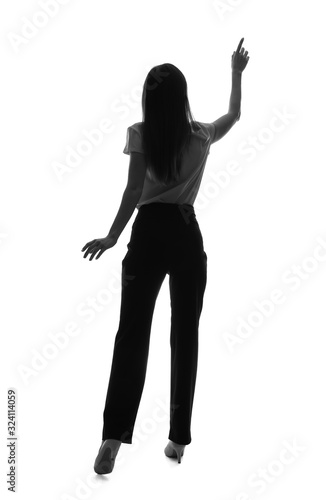 Silhouette of businesswoman pointing at something on white background. Concept of choice