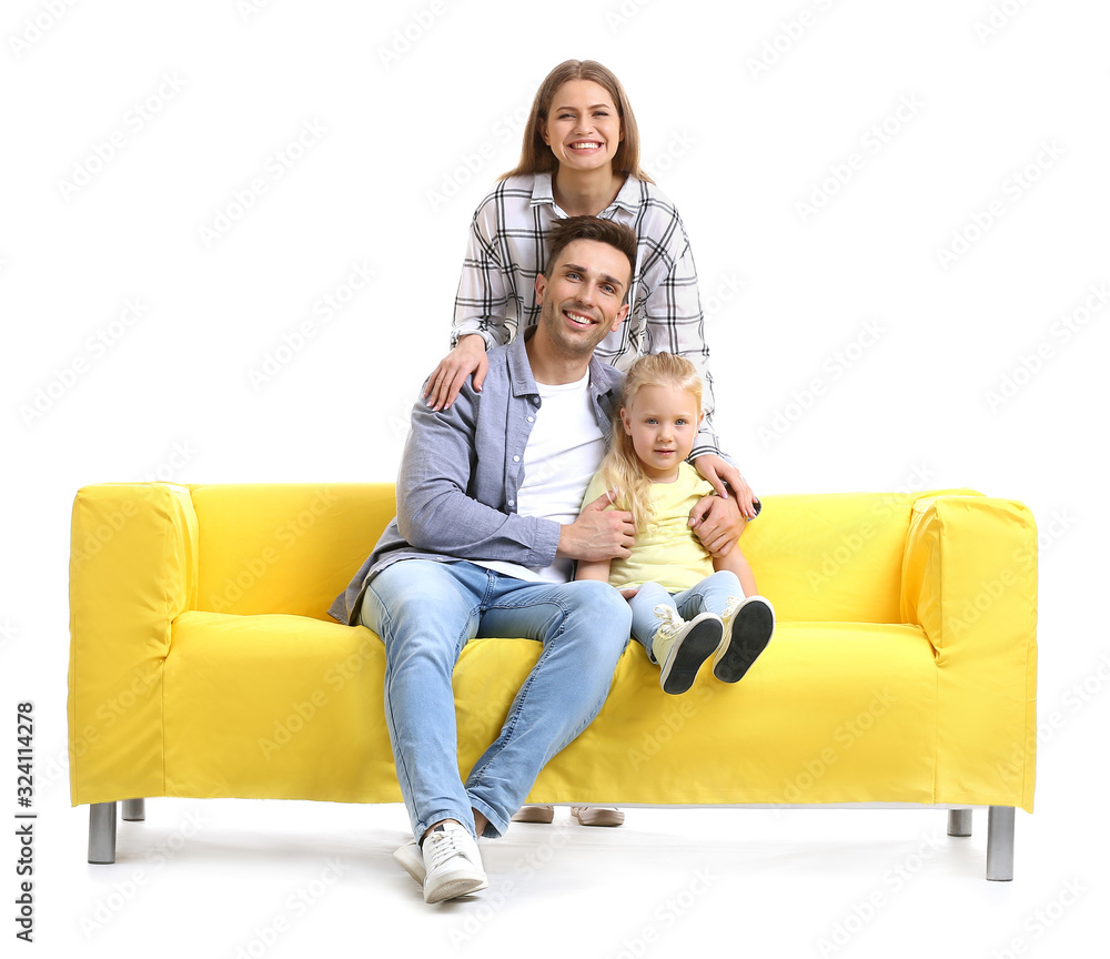 Happy young family with sofa on white background Happy young family with sofa on white background