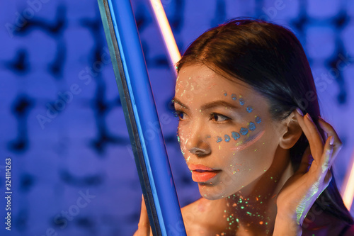Young woman with fluorescen...