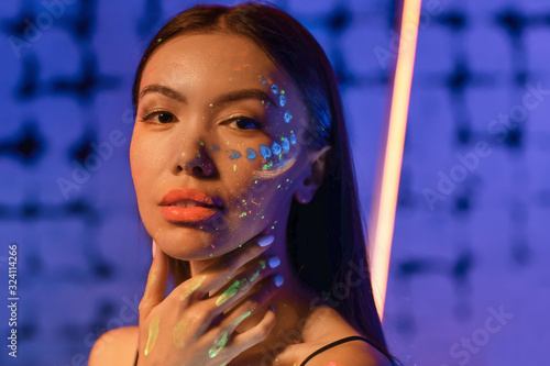 Young woman with fluorescen...