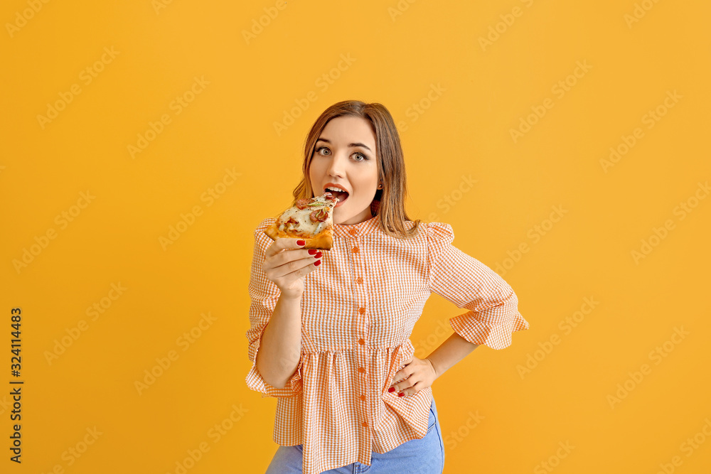 Portrait of beautiful young woman eating pizza on color background Portrait of beautiful young woman eating pizza on color background
