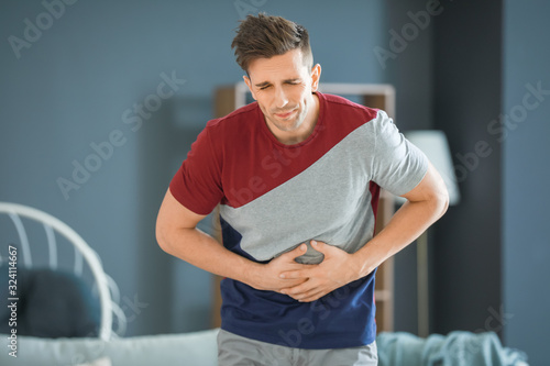 Young man suffering from ab...