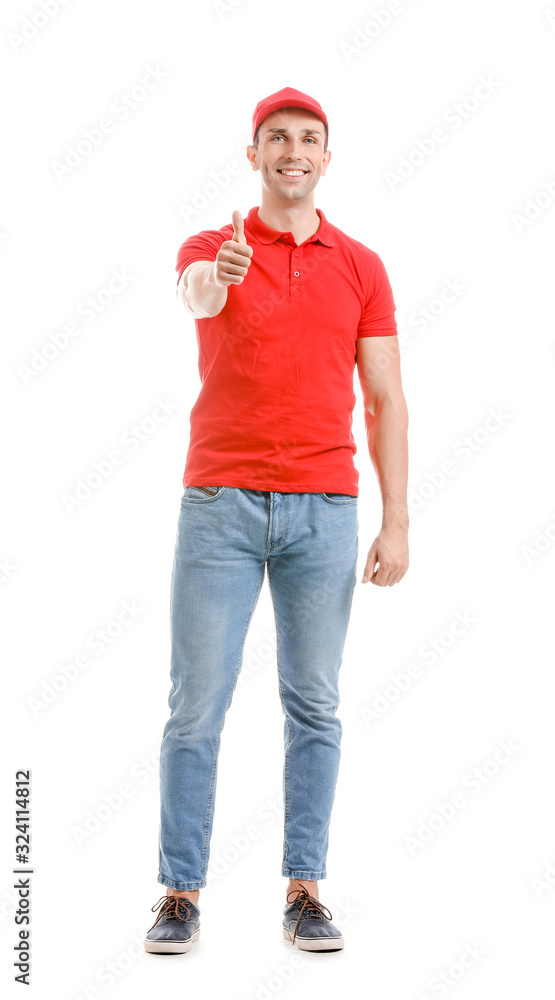 Handsome delivery man showing thumb-up on white background Handsome delivery man showing thumb-up on white background