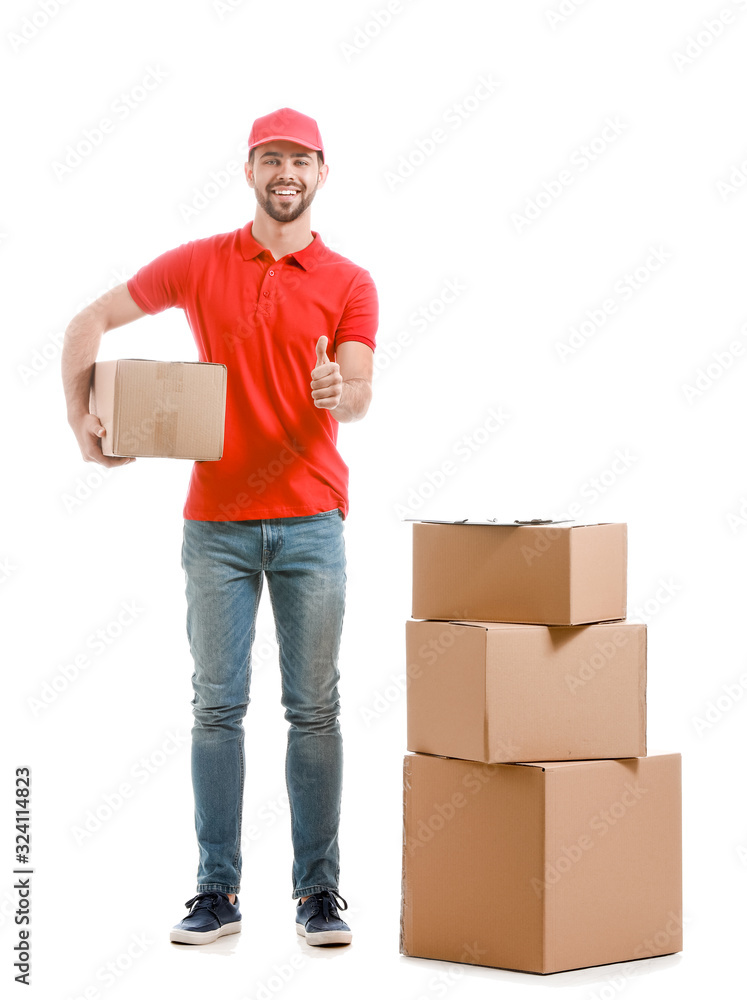 Delivery man with boxes showing thumb-up on white background Delivery man with boxes showing thumb-up on white background