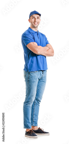 Handsome delivery man on white background © Pixel-Shot