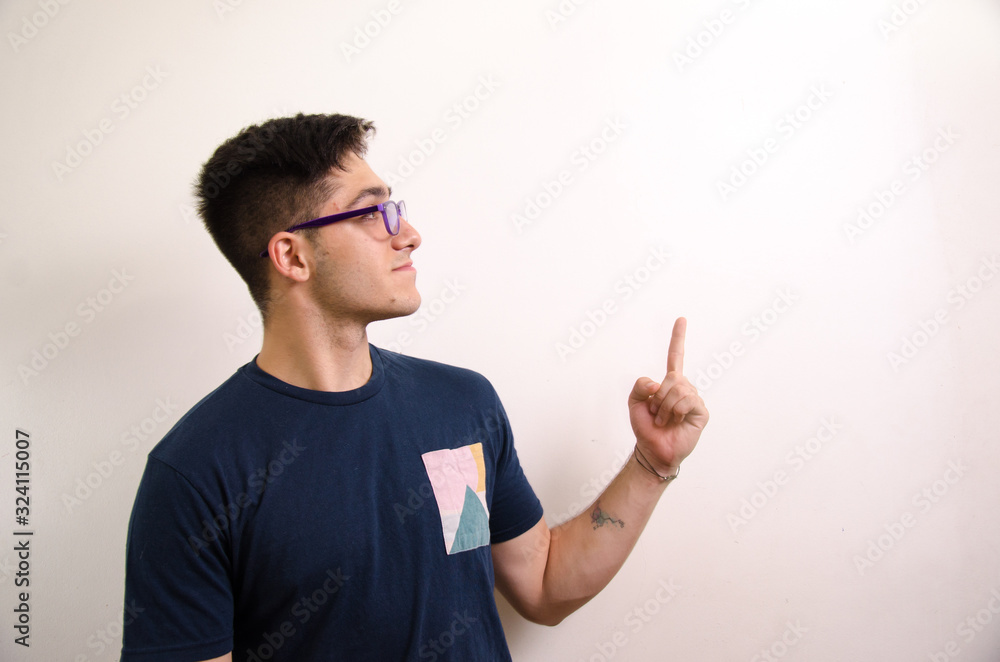 Young man pointing with his fingers Young man pointing with his fingers