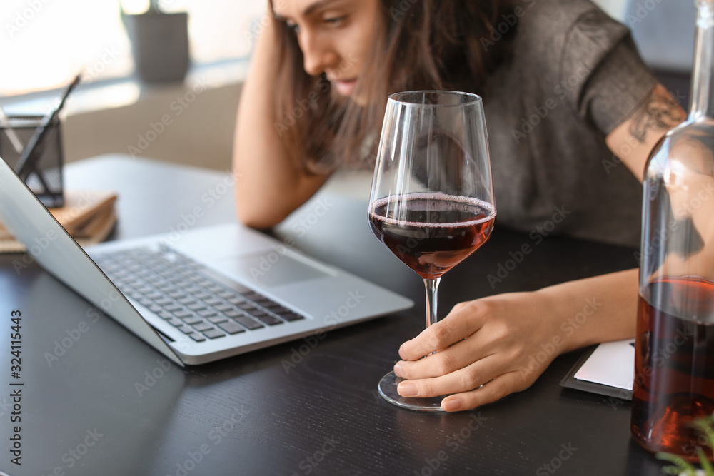 Young drunk woman in office. Concept of alcoholism Young drunk woman in office. Concept of alcoholism