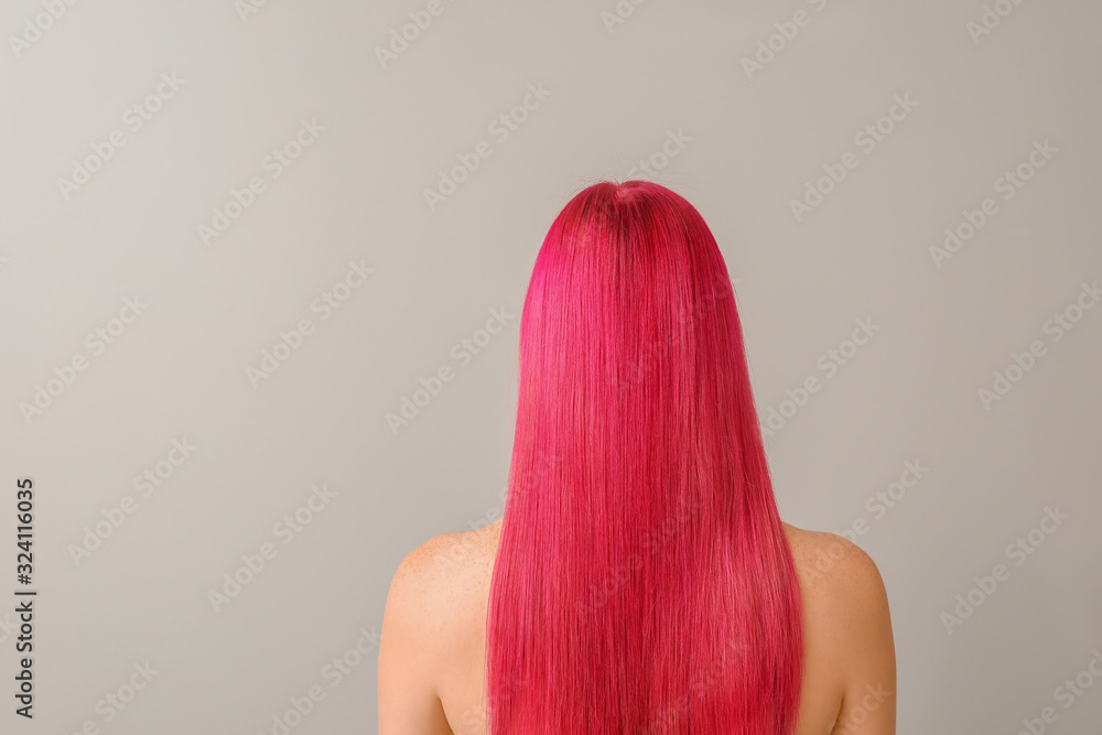 Obraz premium Beautiful young woman with unusual hair color on light background