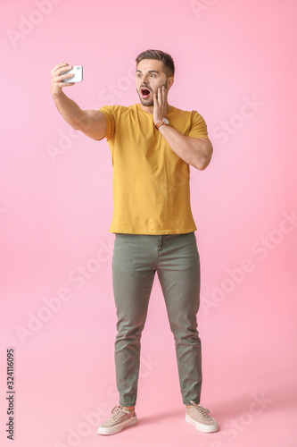 Shocked young man taking se...