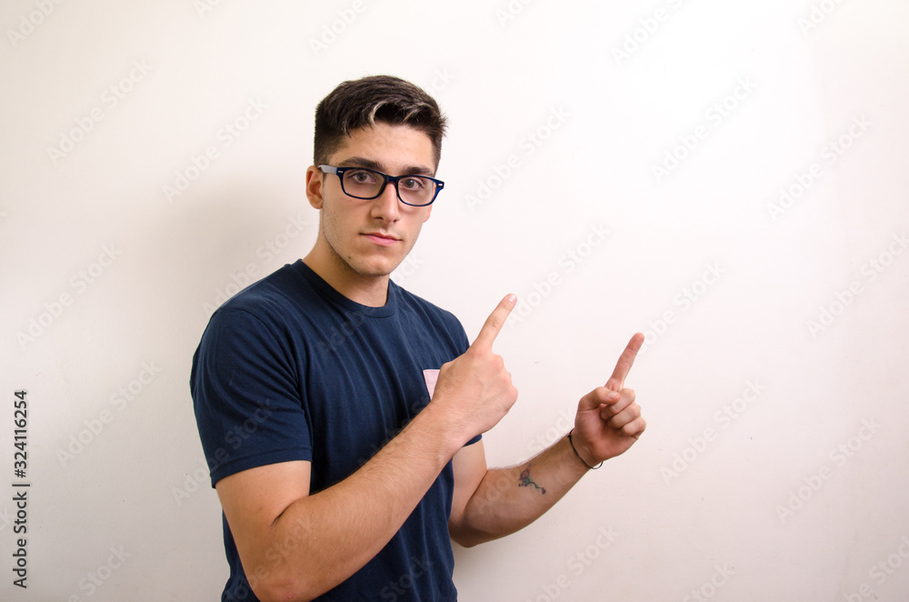 Fototapeta premium Young man pointing with his fingers