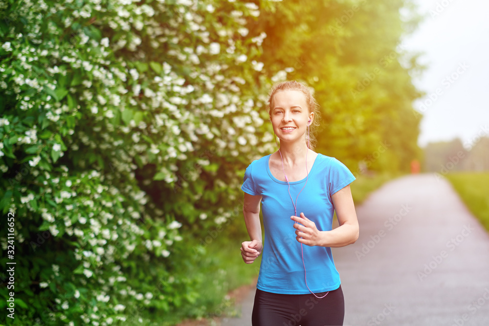 Running woman atletic spotsman training in the summer park. Outdoor fitness portrait Running woman atletic spotsman training in the summer park. Outdoor fitness portrait