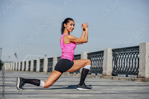 Fitness young woman stretching legs after run. outdoors sport portrait © Joe-L