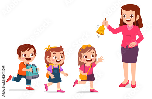 happy cute little kid boy and girl with teacher ring a bell