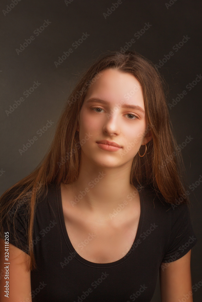 Studio portrait of a girl in a black t-shirt Studio portrait of a girl in a black t-shirt