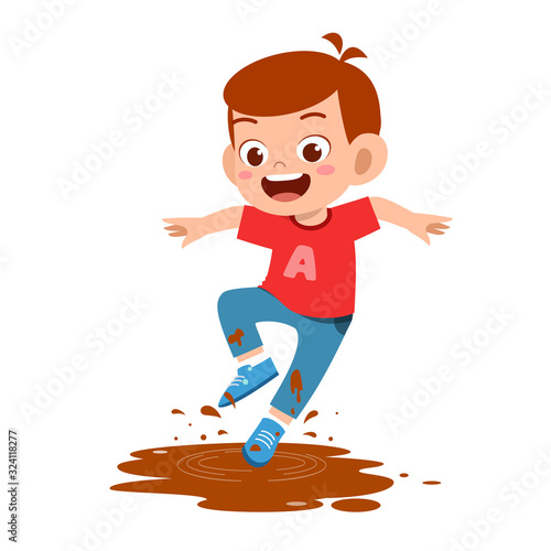 happy cute little kid boy jump on mud