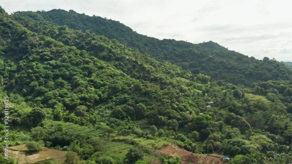 Aerial Panning View of a Tree Covered Mountain Range with Rice Terraces in the Philippines in 4K Aerial Panning View of a Tree Covered Mountain Range with Rice Terraces in the Philippines in 4K
