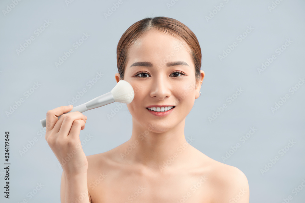 Closeup Of Beautiful Young Female Model Putting Blush With Cosmetic Brush. Closeup Of Beautiful Young Female Model Putting Blush With Cosmetic Brush.