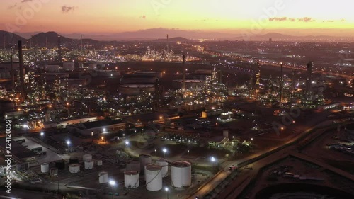 Wallpaper Mural Aerial view footage B roll light oil terminal is industrial facility for storage of oil and petrochemical. oil manufacturing products. power electric plant. low light. Footage b roll drone shot 4k. Torontodigital.ca