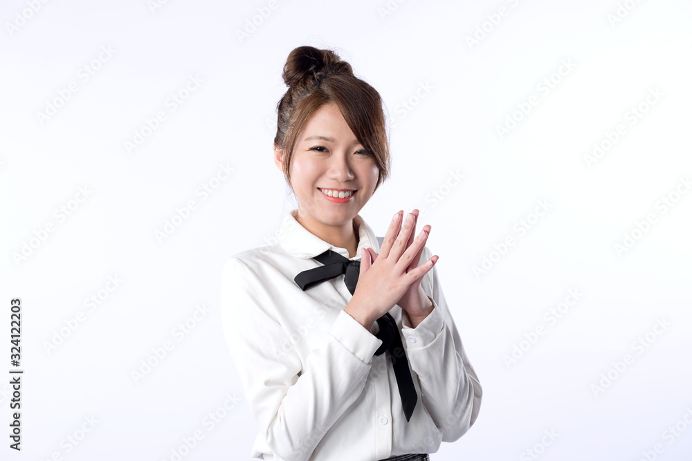 Happy cheerful young girl looking at camera and holding two hands together with joyful and charming smile. Happy cheerful young girl looking at camera and holding two hands together with joyful and charming smile.